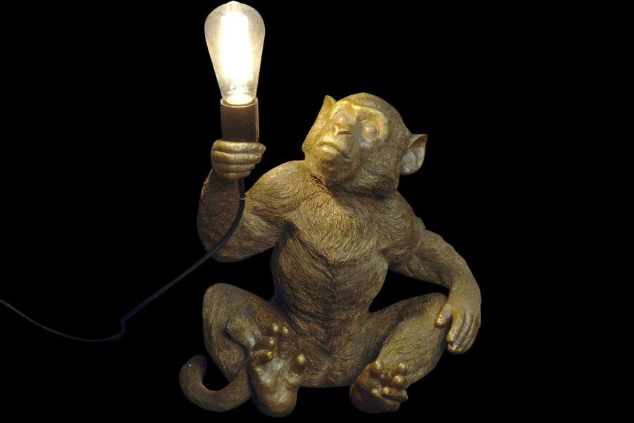 Lámpara de mesa mono dorado